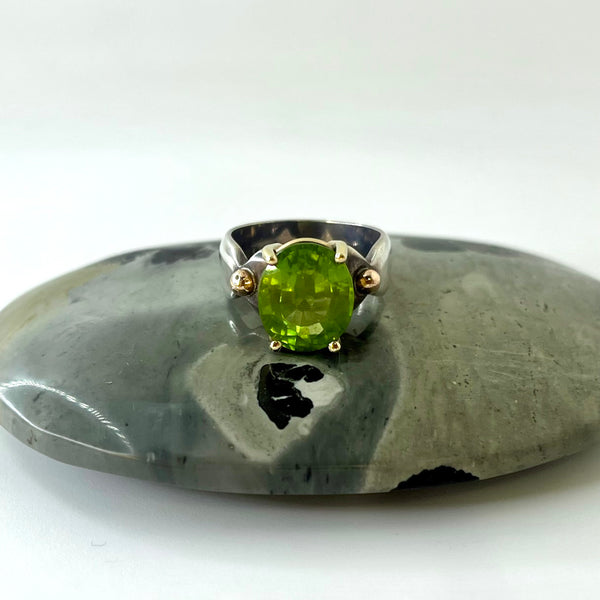 Oval Peridot Gold and Silver Ring