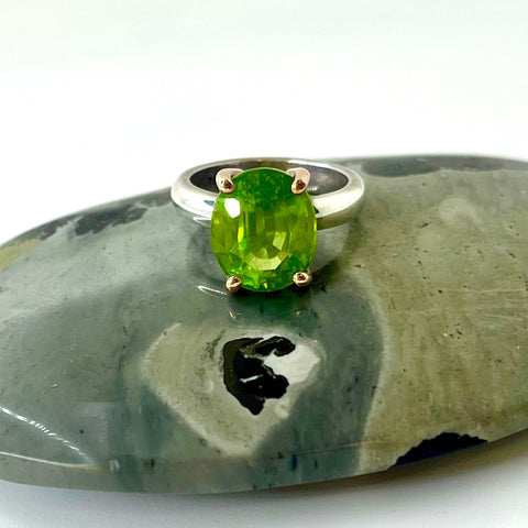 Oval Peridot Gold and Silver Ring